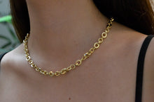 Load image into Gallery viewer, Gold chain necklace on a person's neck with a blurred background