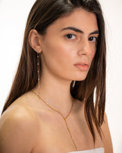 Load image into Gallery viewer, Woman wearing a gold necklace and earrings on a white background