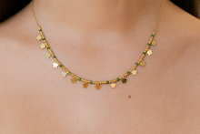 Load image into Gallery viewer, Gold necklace with green and gold beads on a person's neck