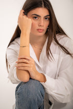 Load image into Gallery viewer, Woman wearing gold bracelets on a white background
