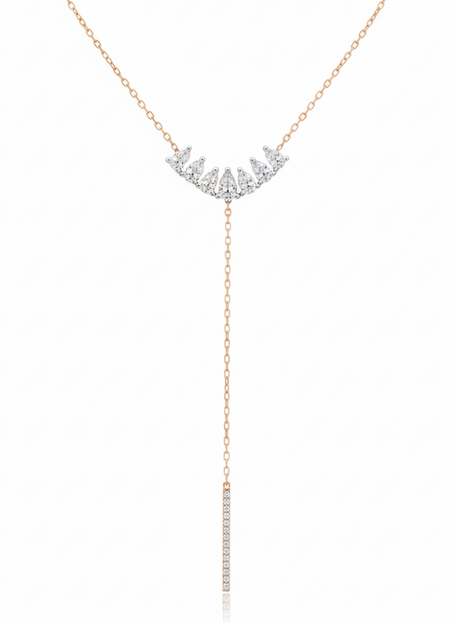 Rose gold necklace with diamond fringe on a white background