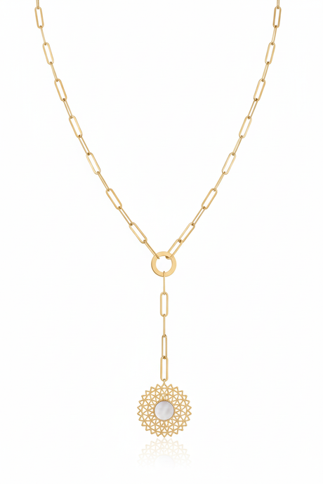 Gold necklace with a circular pendant on a white background