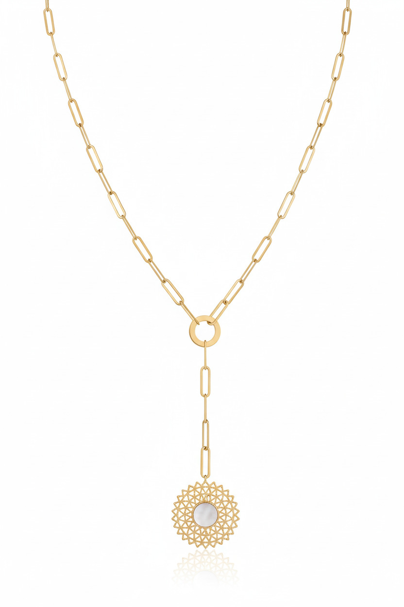 Gold necklace with a circular pendant on a white background