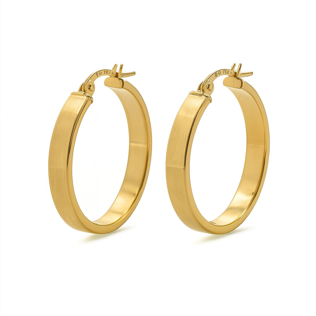 Gold hoop earrings on a white background