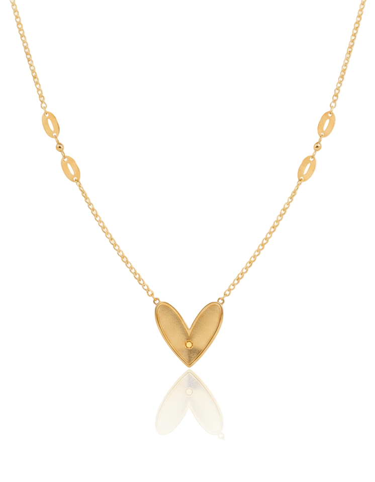 Gold necklace with a heart-shaped pendant on a white background