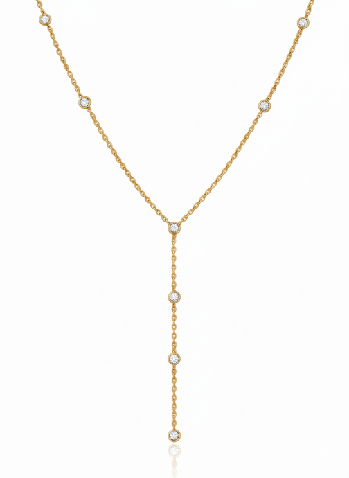 Gold necklace with small pearls on a white background
