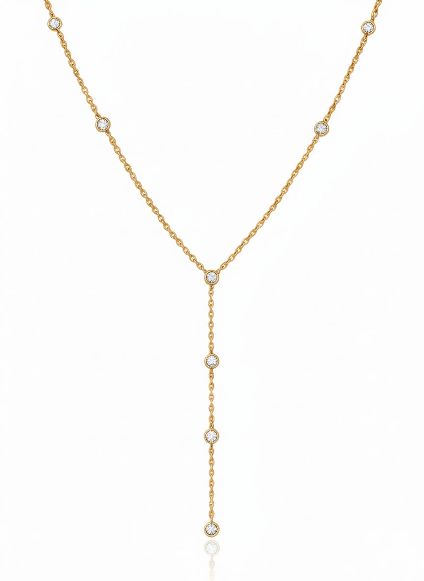 Gold necklace with small pearls on a white background
