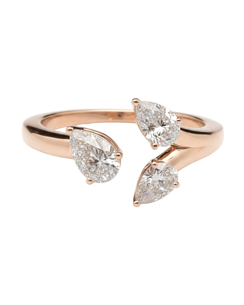 Rose gold ring with three pear-shaped diamonds on a white background