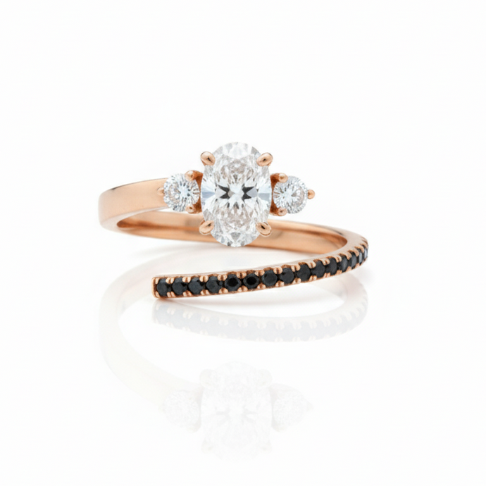 Rose gold ring with diamond cluster on a white background