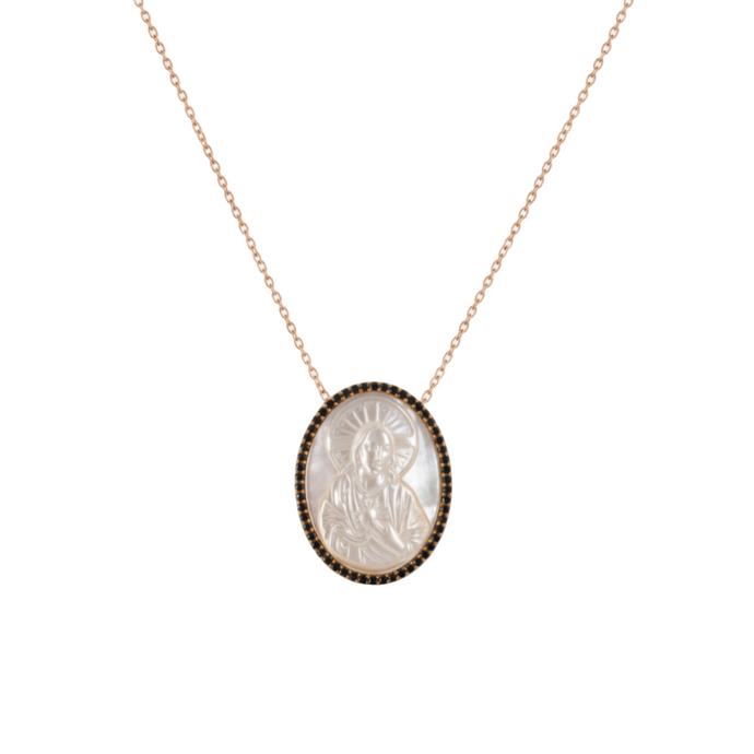 Necklace with a pendant featuring an engraved design on a white background