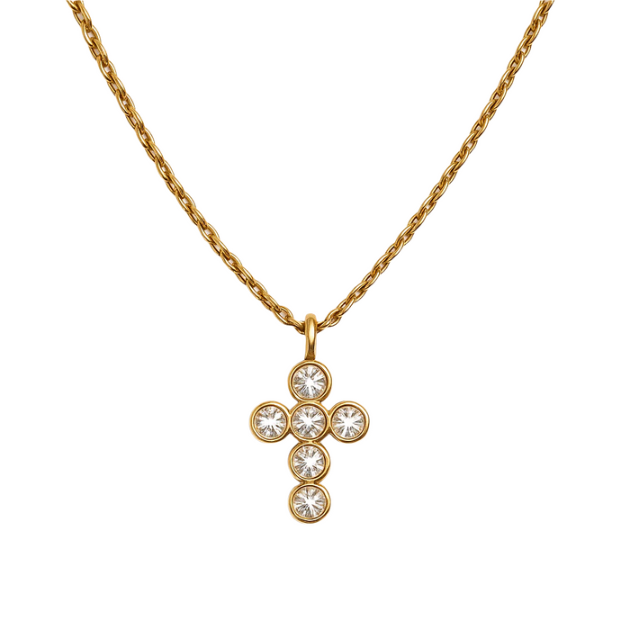 A gold-colored necklace with a charm in the shape of a cross, featuring small white stones arranged in a circular pattern on the charm.