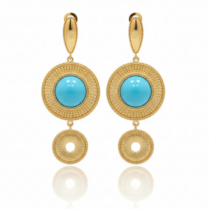 Gold earrings with turquoise stones on a white background