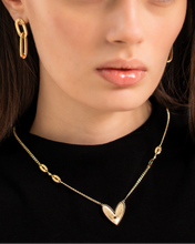 Load image into Gallery viewer, Woman wearing a gold necklace and earrings on a plain background
