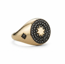 Load image into Gallery viewer, Gold ring with star design and black gemstones on a white background
