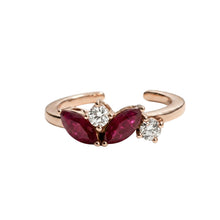Load image into Gallery viewer, Rose gold ring with red gemstones and diamonds on a white background
