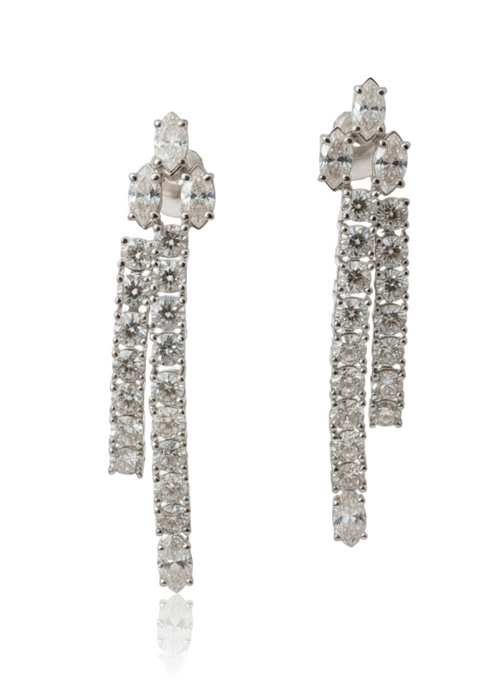 Pair of white gold earrings with clear gemstones on a white background
