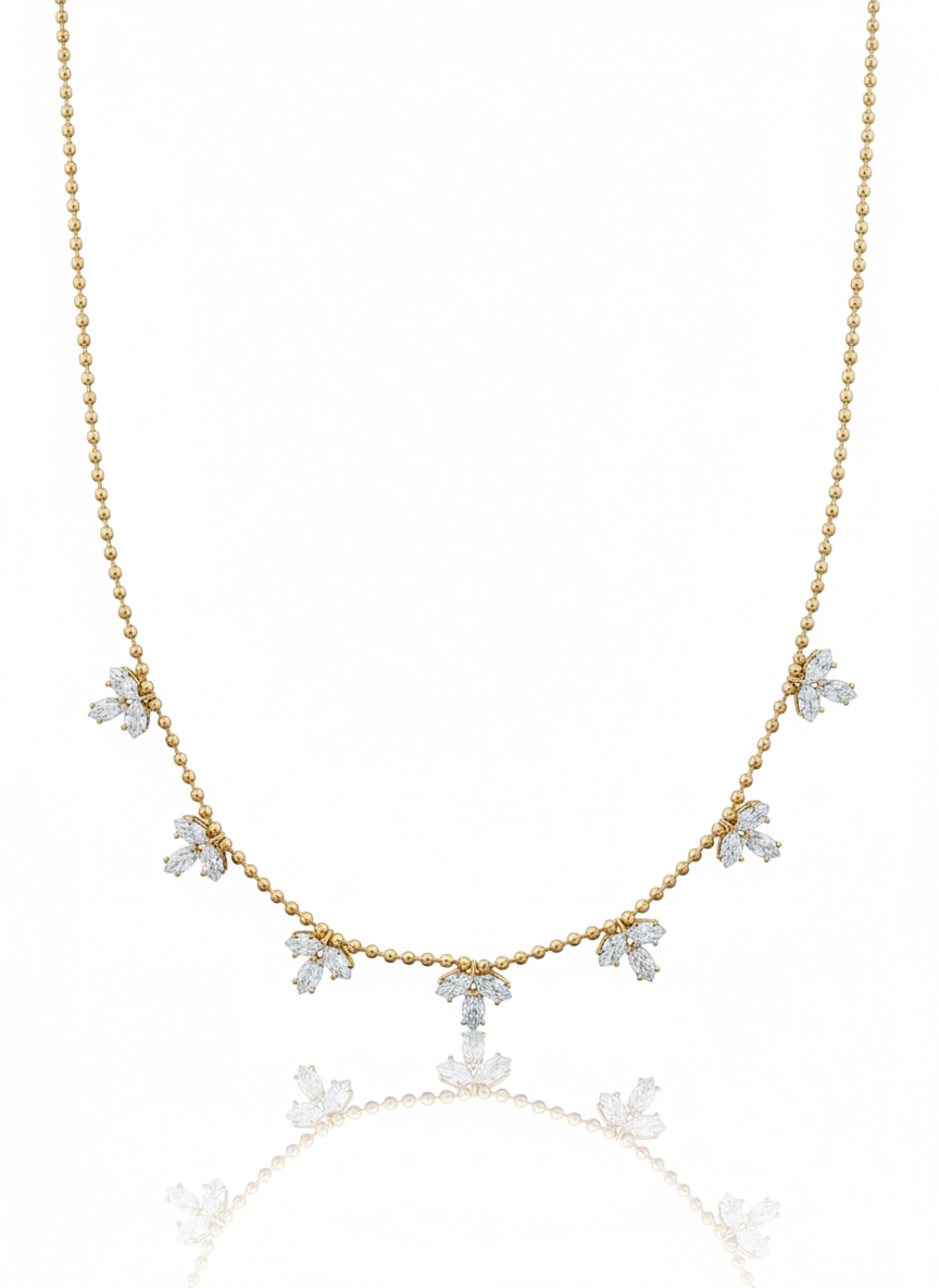 Gold necklace with diamond pendants on a white background